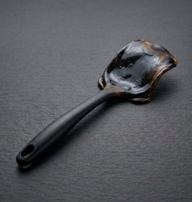 Melted plastic spatula after heat damage