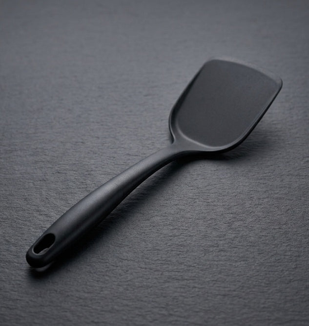 Intact plastic spatula before heat
